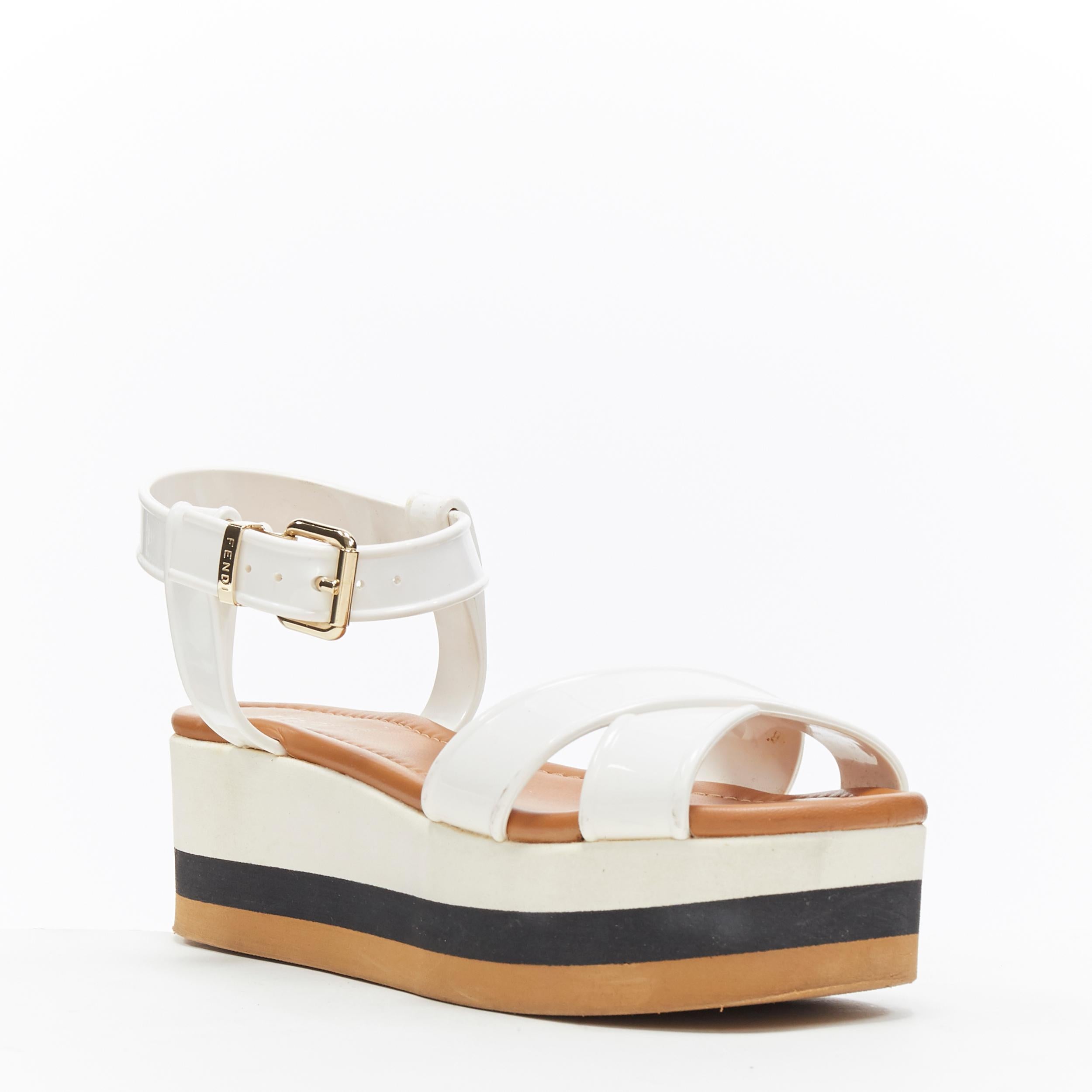 FENDI white jelly rubber ankle strap beige tricolor flat platform sandals EU36
Brand: Fendi
Model Name / Style: Flatform
Material: PVC
Color: White
Pattern: Solid
Closure: Ankle strap
Extra Detail: Low (1-1.9 in) heel height. Open toe.
Made in: