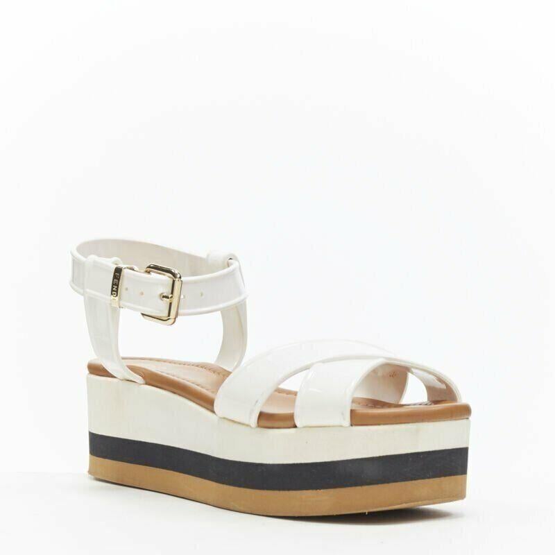 FENDI white jelly rubber ankle strap beige tricolor flat platform sandals EU36
Reference: TGAS/A05230
Brand: Fendi
Model: Flatform
Material: PVC
Color: White
Pattern: Solid
Closure: Ankle Strap
Made in: Italy

CONDITION:
Condition: Good, this item