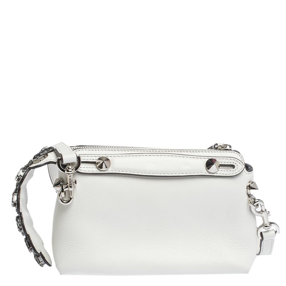 A new design from Fendi, this By the Way Crossbody bag is made from white leather. Complemented by silver-tone hardware, it has a long shoulder strap for crossbody wear. Its main compartment has room for the essentials and is secured by a zip