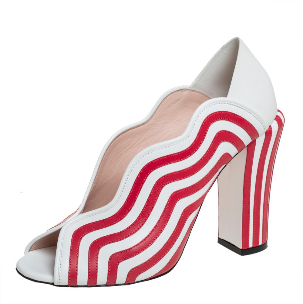 These Fendi sandals blend comfort and style perfectly with a hint of edginess! The sandals are crafted from leather and feature a peep-toe silhouette. They flaunt wavy striped patterns all over and a well-cut curvy upper and are elevated on 12 cm