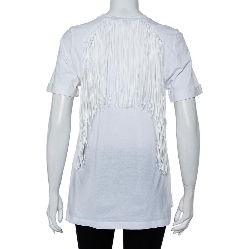 This amazing T-shirt from Fendi is perfect to add to your collection of luxe casuals. The cotton creation features a sequin embroidered logo on the front and fringe detailing at the back. It comes with a crew neck and short sleeves.

Includes: Brand