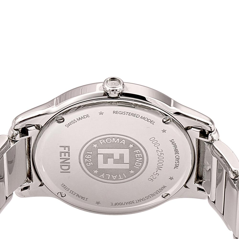 This Fendi Swiss-made watch is crafted from stainless steel and has a white dial with two hands, Roman numerals, and logo accents. It follows a quartz movement, and it is water-resistant up to 30 meters. The watch is complete with a solid case back