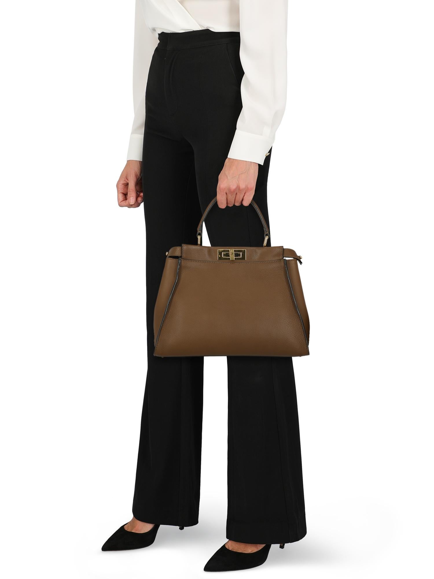 Peekaboo is the quintessential Fendi handbag, its timeless design speaks to your soul. Immediately recognizable for its unique closure, Peekaboo features two internal compartments divided by a stiff central partition and truly glamorous