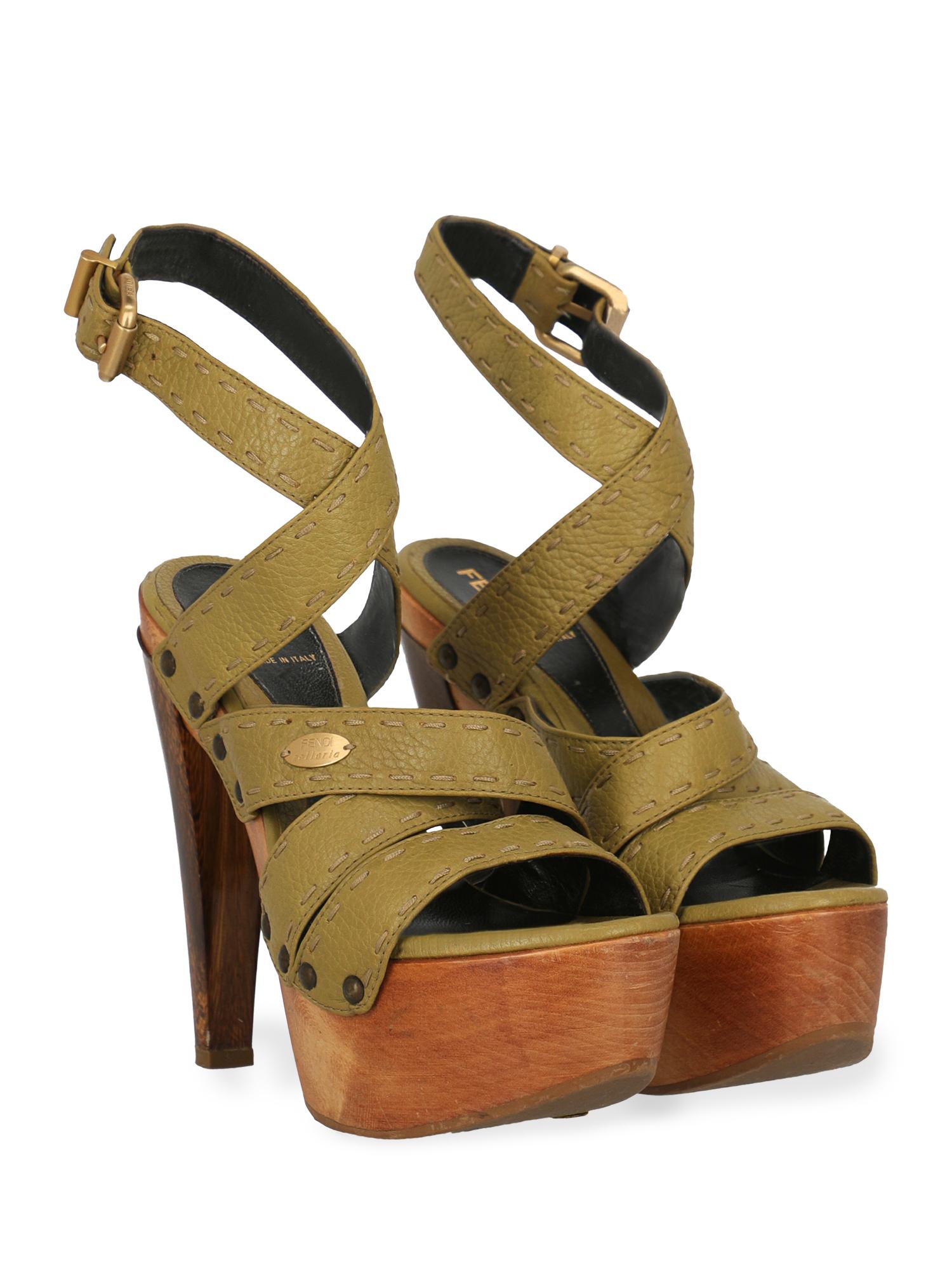 Product Description: Sandals, leather, solid color, side logo, buckle fastening, gold-tone hardware, open toe, branded insole, tapered heel, high heel

Includes:
- Dust bag

Product Condition: Very Good
Heel: visible marks. Sole: visible signs of