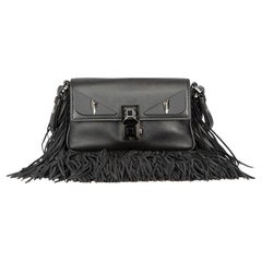 Fendi Damen Monster Micro Baguette aus schwarzem Leder mit Fransen