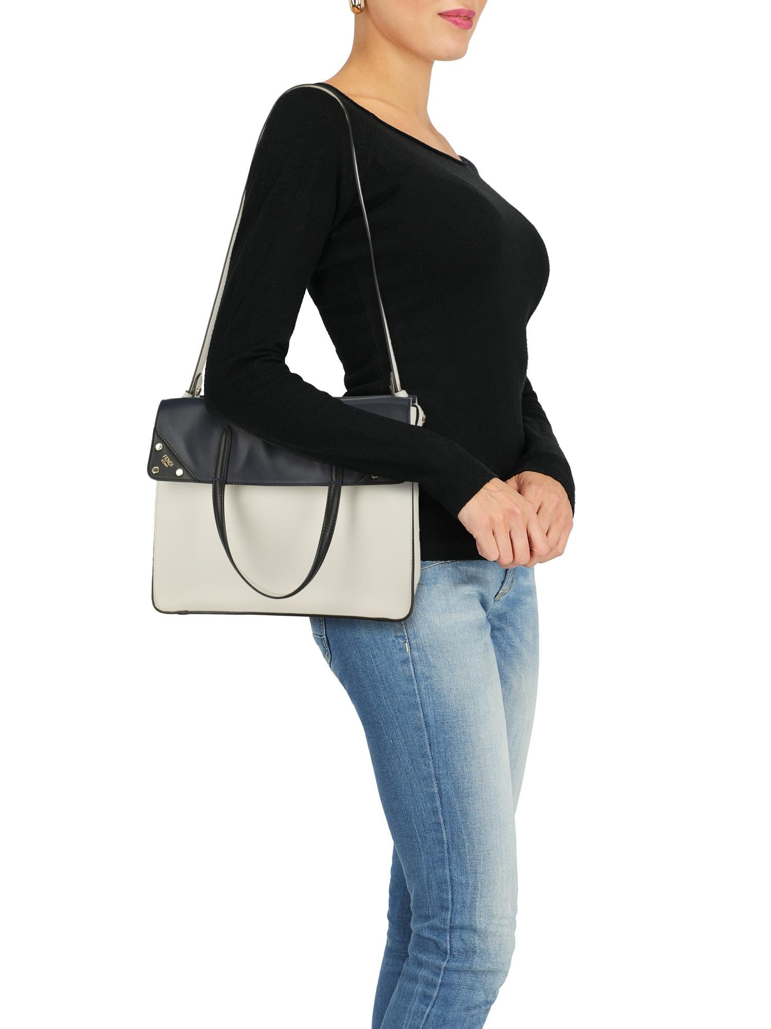 Product Description: Bag, leather, solid color, two-tone, logo print to the front, removable shoulder strap, gold-tone hardware, internal pockets, suede lining.

Includes:
 Shoulder strap

Product Condition: Excellent
Lining: negligible marks.