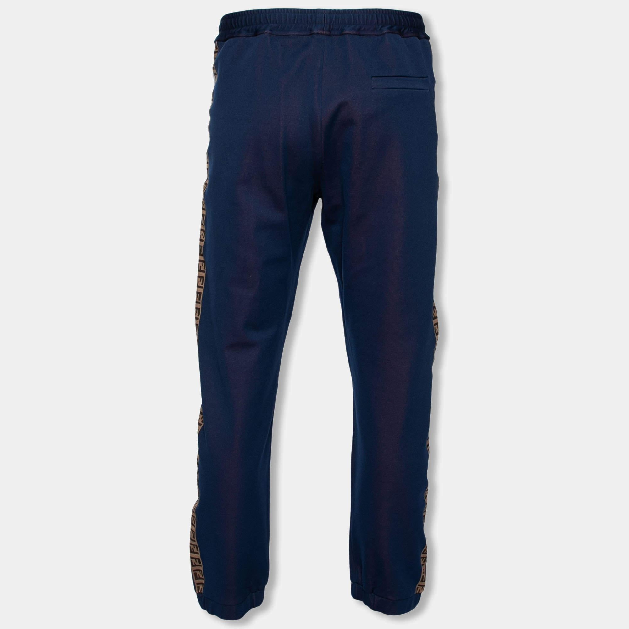 These track pants come from the Fendi x Hey Reilly collaboration and truly showcase artistic craftsmanship. They have a blue shade with logo tape trims on the sides and have been made from a cotton blend. Team them with a simple tee and sneakers.

