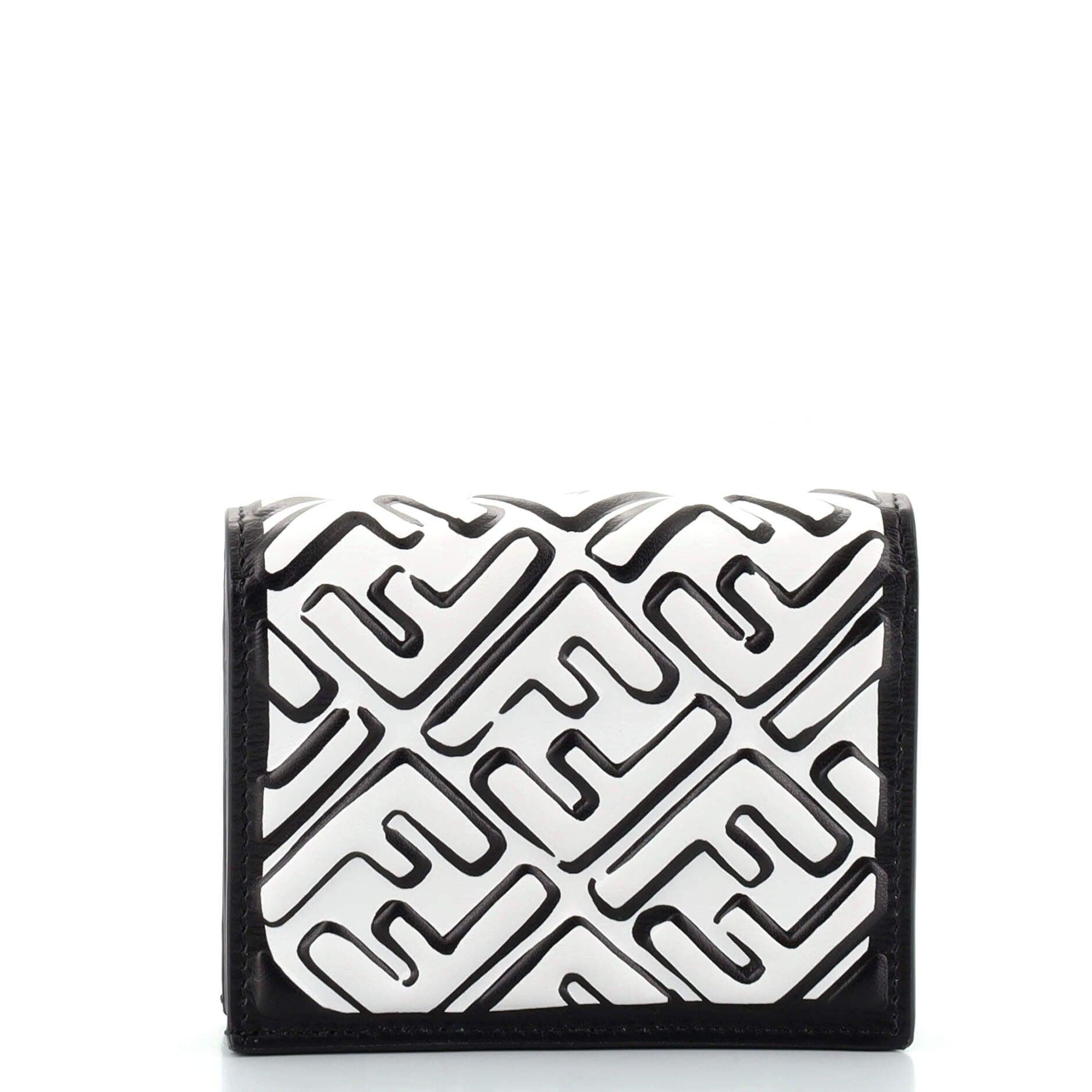 Fendi x Joshua Vibes Black White FF Embossed Printed Zucca Leather Compact Bifold Wallet

Condition Details: Minimal wear on exterior, scratches on hardware.

68108MSC

Measurements: Height 3.5