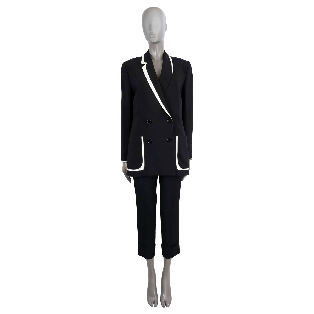 100% authentic Fendi x Joshua Vides double-breasted tuxedo blazer in black viscose (100%). Features asymmetric contrast piping in white lambskin leather, notch lapel, a chest pocket and two patch pockets on the front. Closes with buttons on the