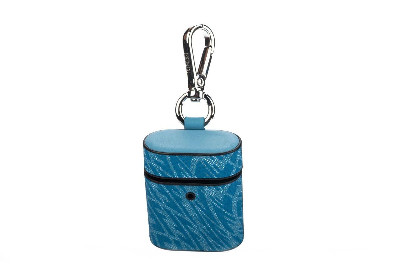 Fendi x Sarah Coleman AirPod case in light blue with bull eye pattern consisting of multiple Fs. The piece is new and comes with a box, dustcover, booklet and tag.
