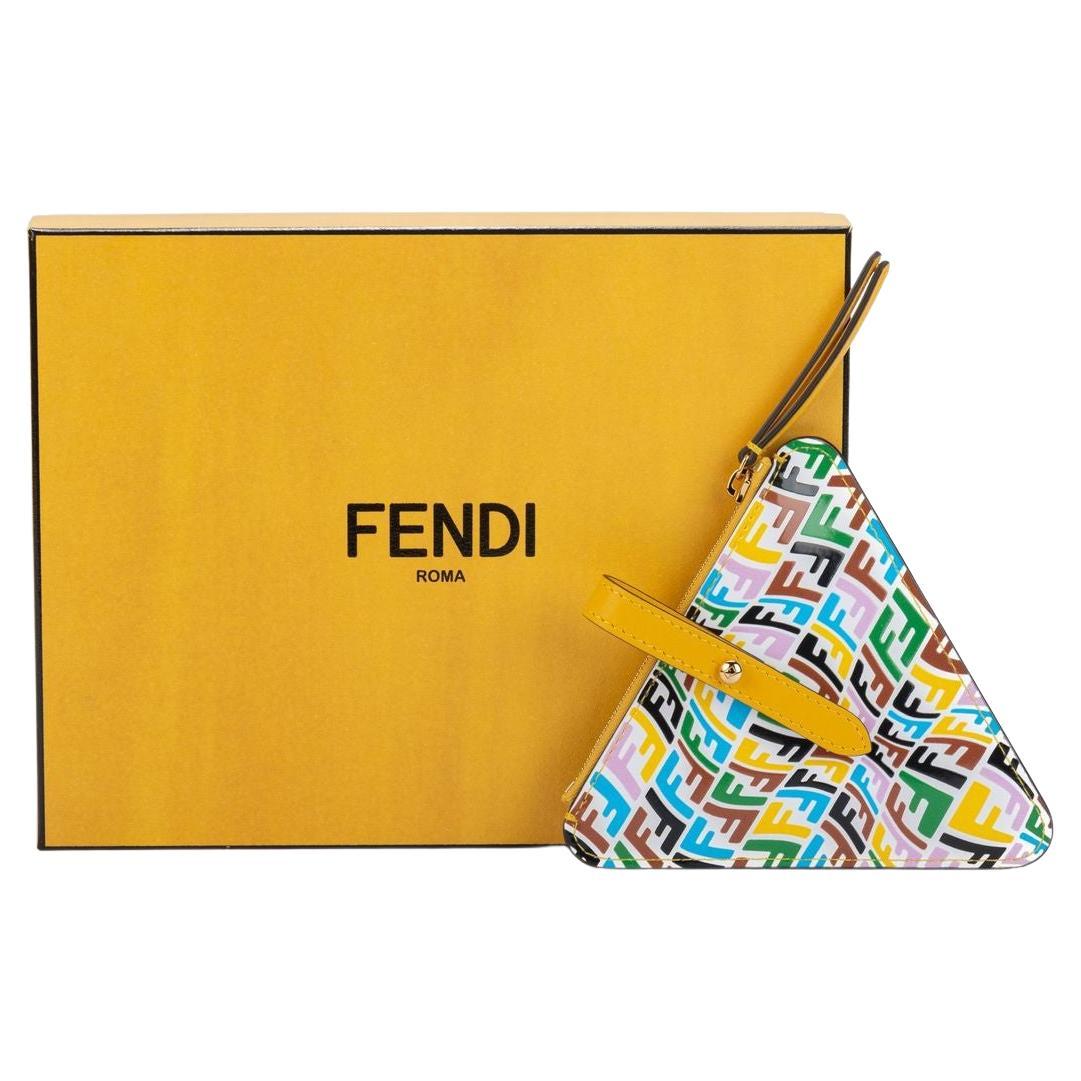 Fendi x Sarah Coleman coin purse. The purse has a multicolor bull eye pattern. The form of the piece is a triangle and it has a little clasp on top to attached it to a bag. The item is new and comes with the box, dustcover and booklet.
