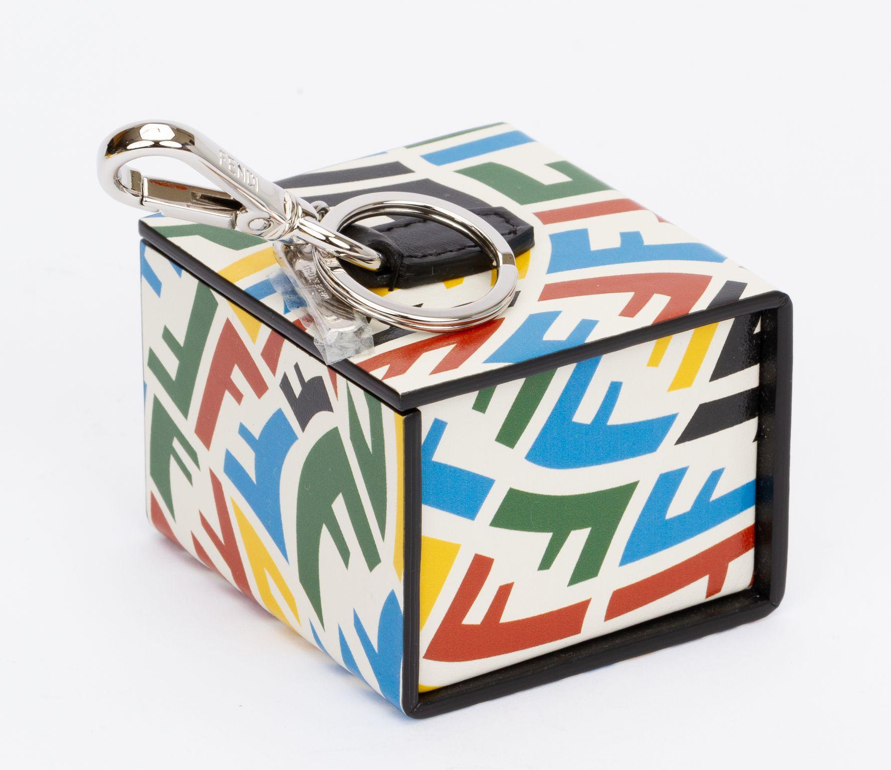 Fendi x Sarah Coleman Vitello FF Vertigo Vertical Box in Multicolor. This bag is made of FF print calfskin leather in multicolor on a white background. The charm features a polished silver hardware so it can be attached to a bigger bag. The magnetic