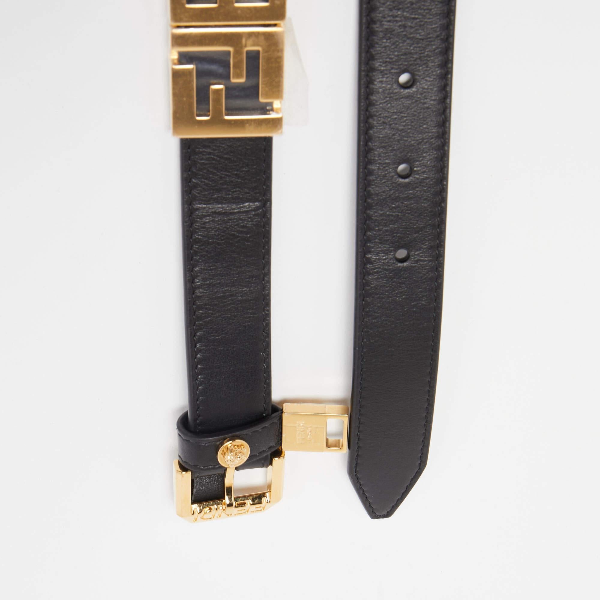 The Fendi x Versace belt is a luxurious fashion accessory that combines the iconic styles of both brands. Made from premium black leather, it features a prominent buckle adorned with FENDACE logo, creating a bold and stylish statement piece.


