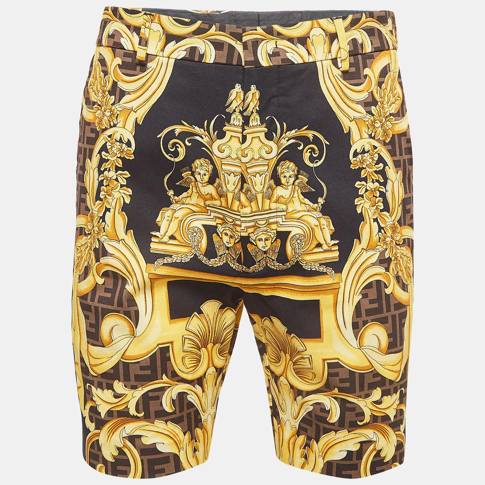 Crafted in luxurious cotton, the Fendi x Versace bermuda shorts fuse opulence with street-style edge. The intricate baroque pattern, featuring striking black and yellow hues, exudes boldness. With a comfortable fit and iconic branding, these shorts