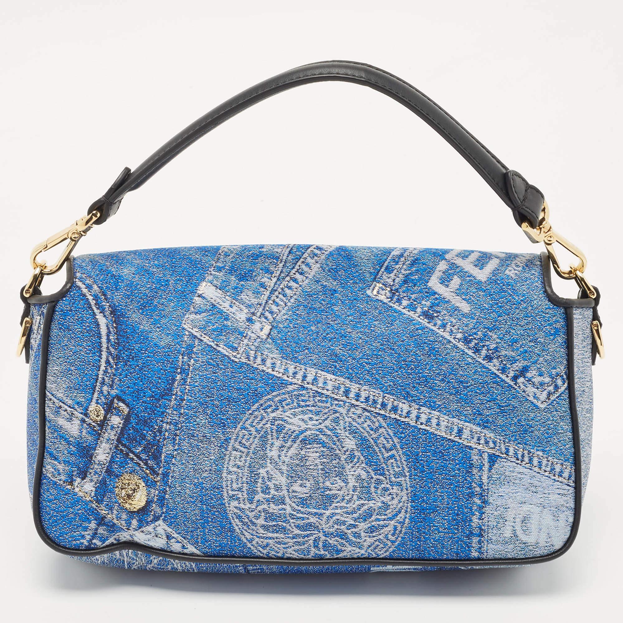 The Fendi x Versace Fendace baguette bag is a remarkable fusion of two iconic fashion powerhouses. Combining the timeless elegance of Fendi's baguette silhouette with the bold, edgy aesthetic of Versace, this bag features a captivating patchwork