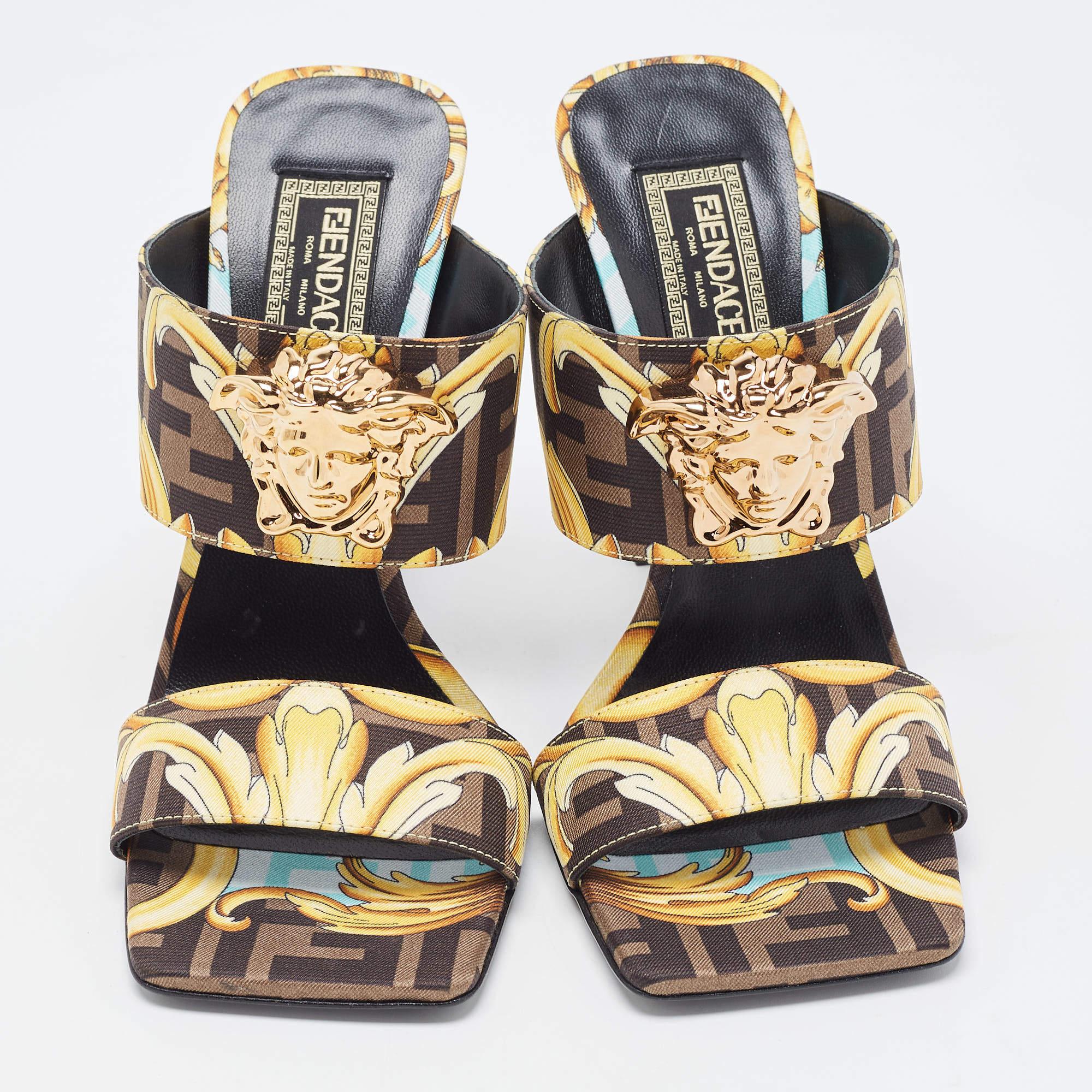 Exhibit an elegant style with this pair of slides. These Fendi x Versace Medusa sandals for women are crafted from quality materials. They are set on durable soles and sleek heels.

Includes: Original Dustbag, Original Box

