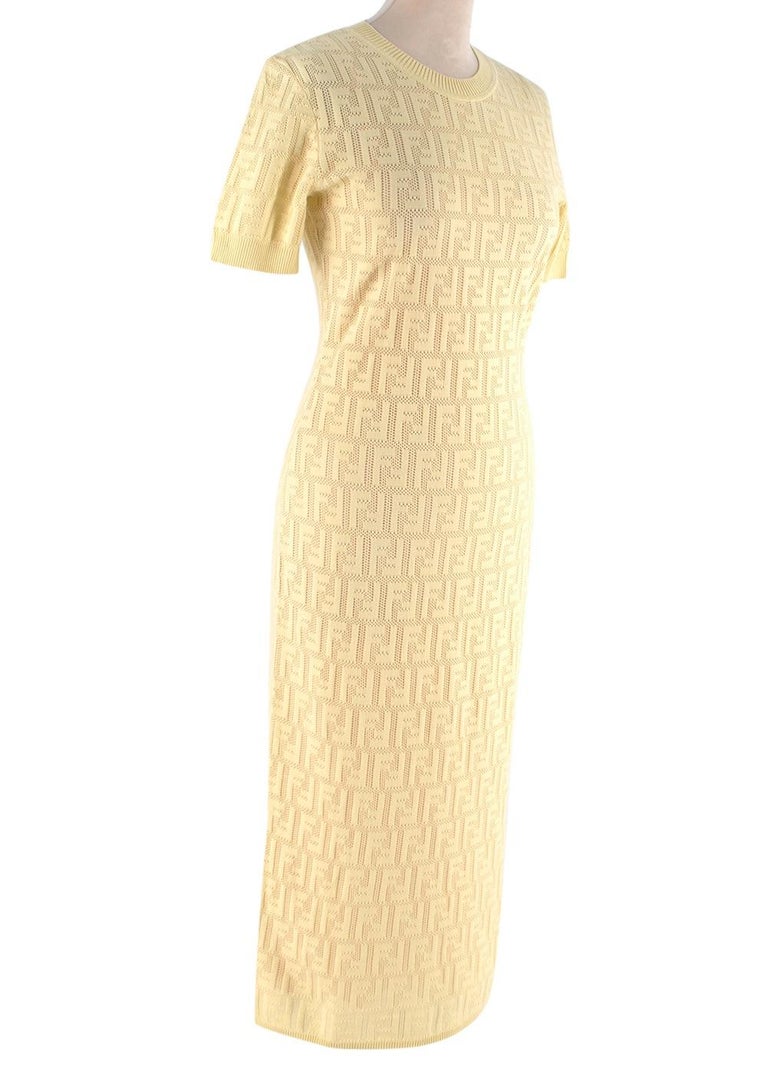 Fendi Yellow FF Monogram Jacquard Dress

 - Close-fitting knitted dress with a tone-on-tone FF monogram 
- Ribbed round neck and short sleeves 
- Mid length 
- Nude pink slip dress

Materials
73% Cotton
19% Polyamide
8% Polyester

Made In Italy
Hand