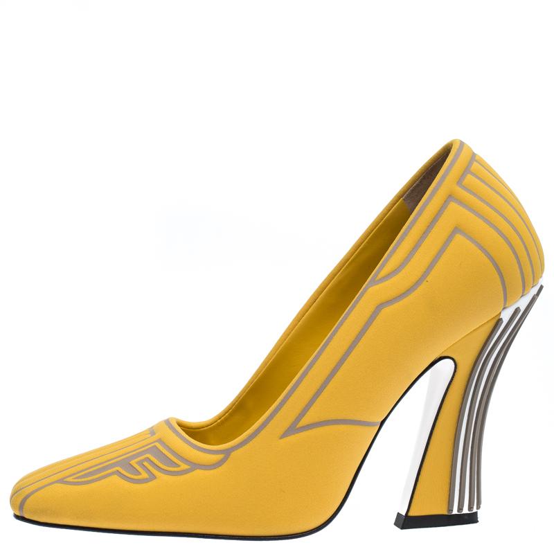 These stylish and unique pumps come from the house of Fendi. Crafted in Italy from quality neoprene and rubber, they come in lovely hues of yellow and grey. They are styled with square toes, 10.5 cm heels with stunning detailing and leather lining,