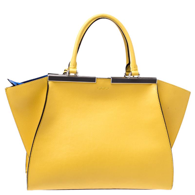 Fendi brings you this stunning update of their famous 2jours bag, the 3Jours! Crafted from leather, the yellow bag has two handles and a gorgeous silver-tone bar on top that is split down the middle. The insides are leather-lined and spacious enough
