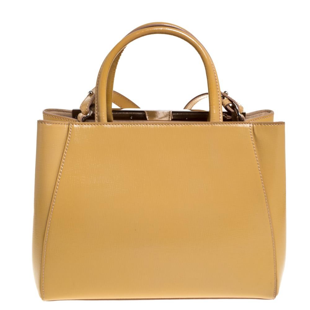 Fendi's 2Jours tote is one of the most iconic designs from the label and it still continues to receive the love of women around the world. Crafted from yellow-hued patent leather, the bag features double rolled handles. It is also equipped with a