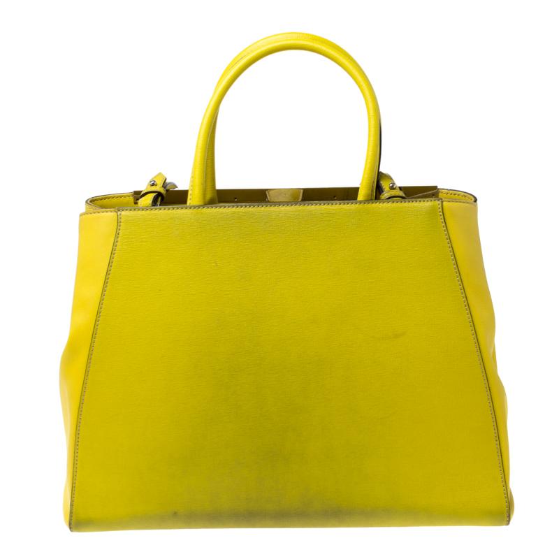 Fendi's 2Jours tote is one of the most iconic designs from the label and it still continues to receive the love of women around the world. Crafted from yellow Saffiano leather, the bag features double rolled handles. It is also equipped with a