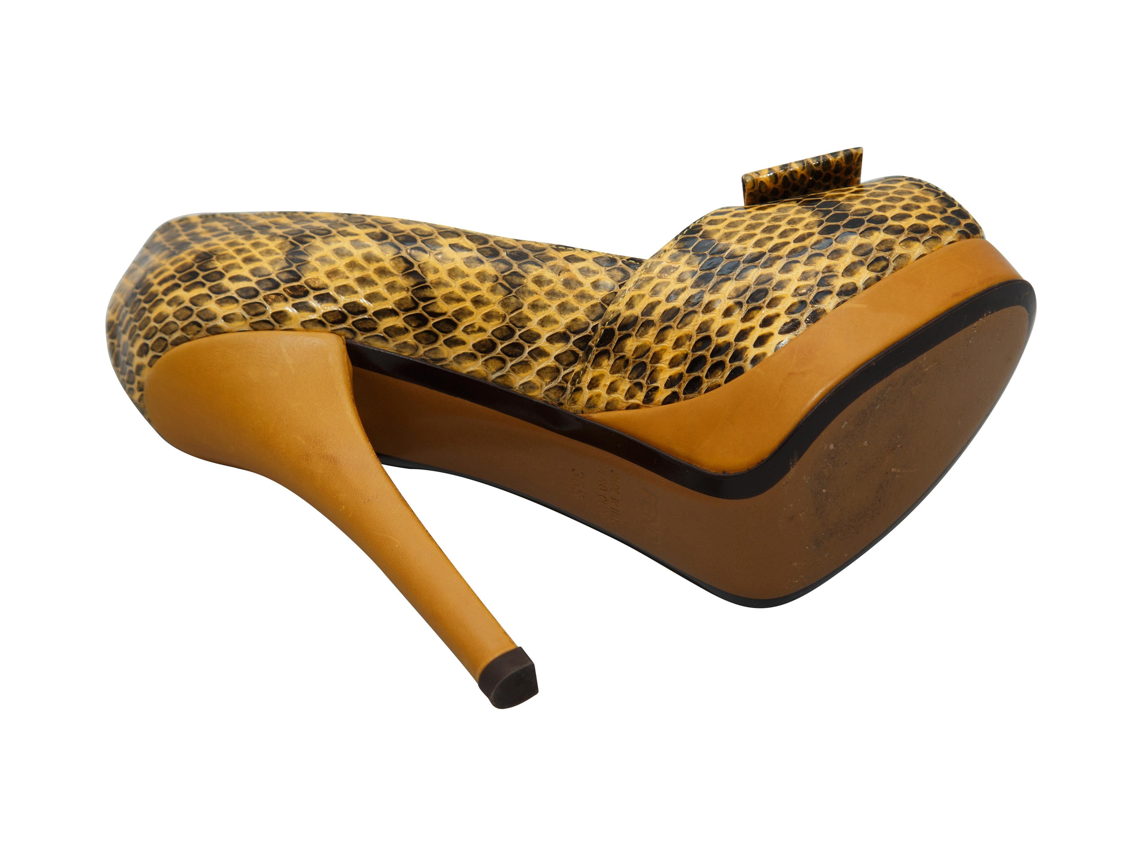 Product details:  Yellow snakeskin platform pumps by Fendi.  Bow accents vamp.  Peep toe.  Towering stiletto heel and platform design.  Slip-on style.  Label size IT 36.5.  5.25