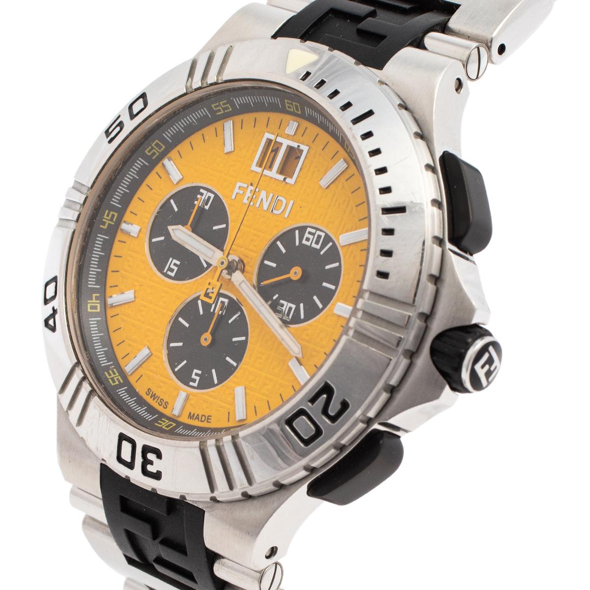 This Fendi Swiss-made watch is crafted from stainless steel and it carries the brand's signature logo on the case. The watch has a yellow dial with three hands and hour markers. It is equipped with three subdials and a tachymeter around the outer