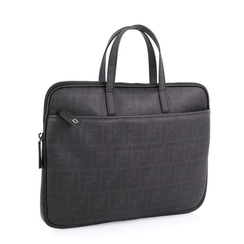 This Fendi Zip Laptop Bag Zucca Coated Canvas, crafted in black Zucca coated canvas, features dual flat handles, exterior front zip pocket and gunmetal-tone hardware. Its zip closure opens to a black fabric interior with slip pockets. .

Condition: