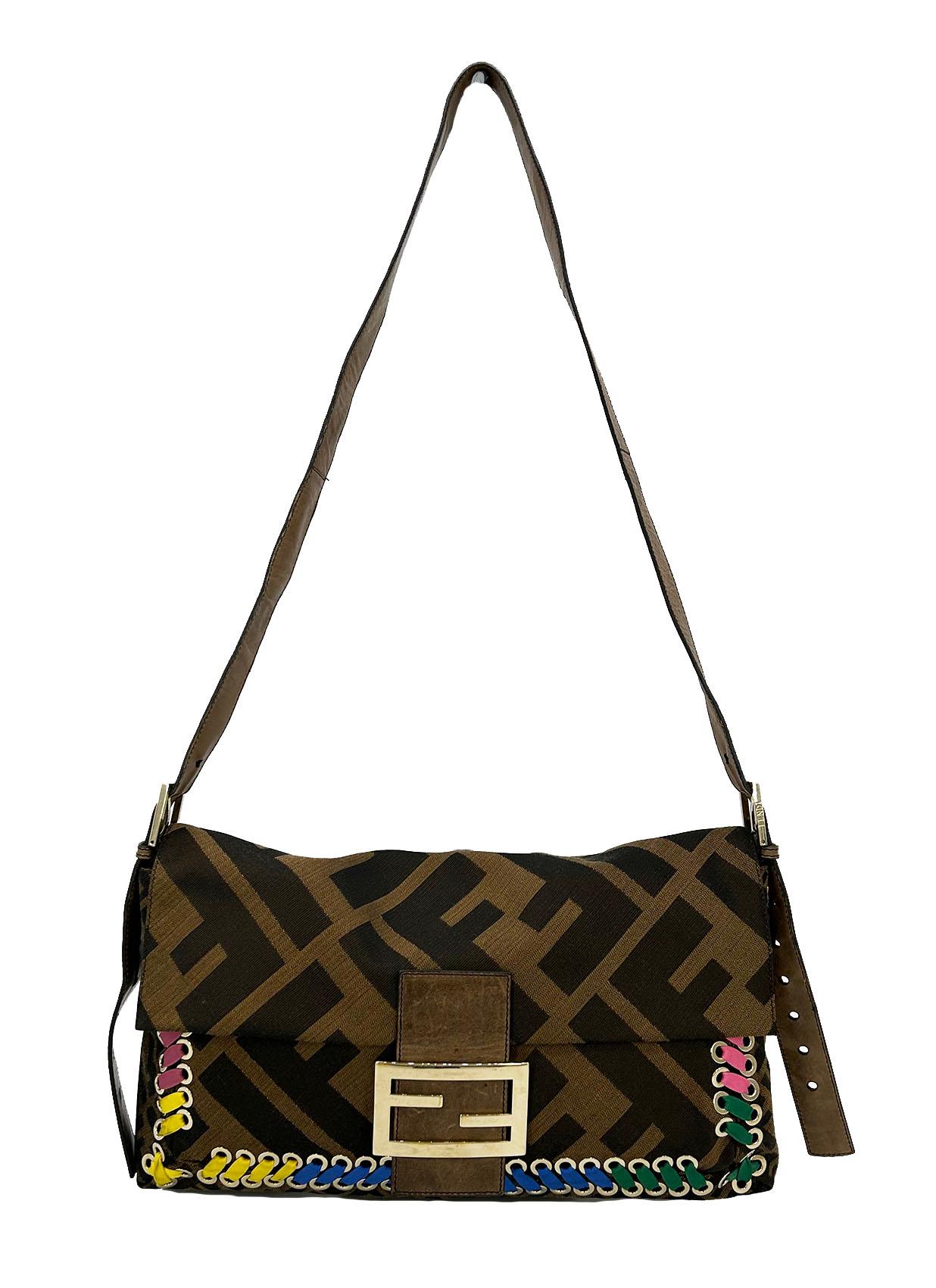 Fendi Zucca Canvas Rainbow Whipstitch XL Baguette in very good condition. Signature zucca monogram print canvas trimmed with brown leather, gold hardware and unique rainbow shoelace style whipstitch along front side. Adjustable and removable