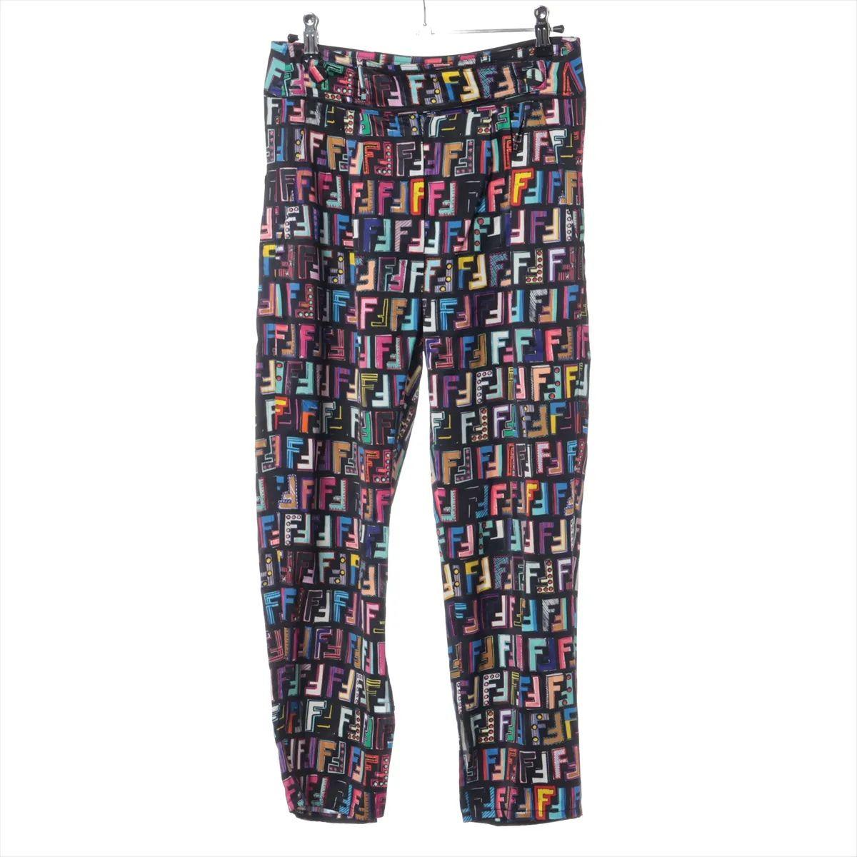 The Fendi Zucca Polyester Rayon Pant in multicolor showcases the iconic FF Zucca monogram pattern in a vibrant and eye-catching palette. Crafted from a luxurious blend of polyester and rayon, the fabric offers a smooth, lightweight feel with a