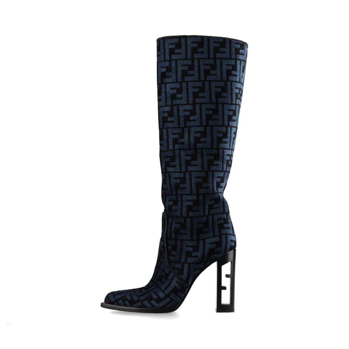 The Fendi Zucca Jacquard Leather Long Boots in Blue showcase a bold and sophisticated design, featuring the iconic FF logo jacquard fabric combined with premium leather accents. The knee-high boots exude luxury with their sleek silhouette and
