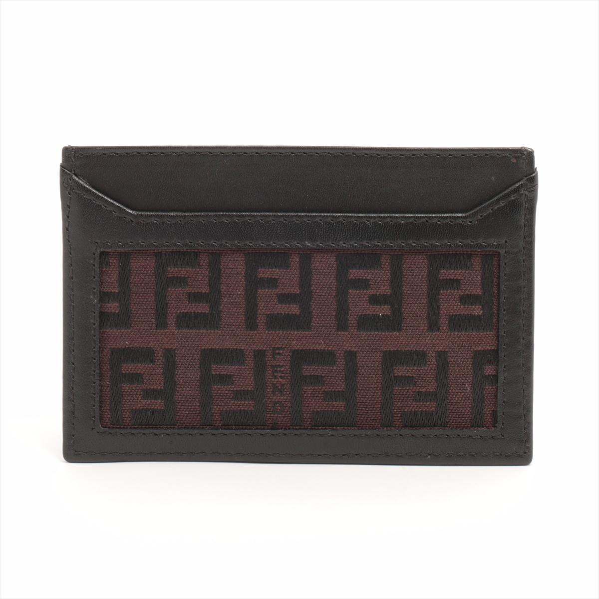 The Fendi Zucca Leather Card Case in Brown is a sleek and sophisticated accessory crafted from high-quality leather, featuring the iconic FF Zucca monogram embossed throughout. Its compact design makes it ideal for carrying essential cards while
