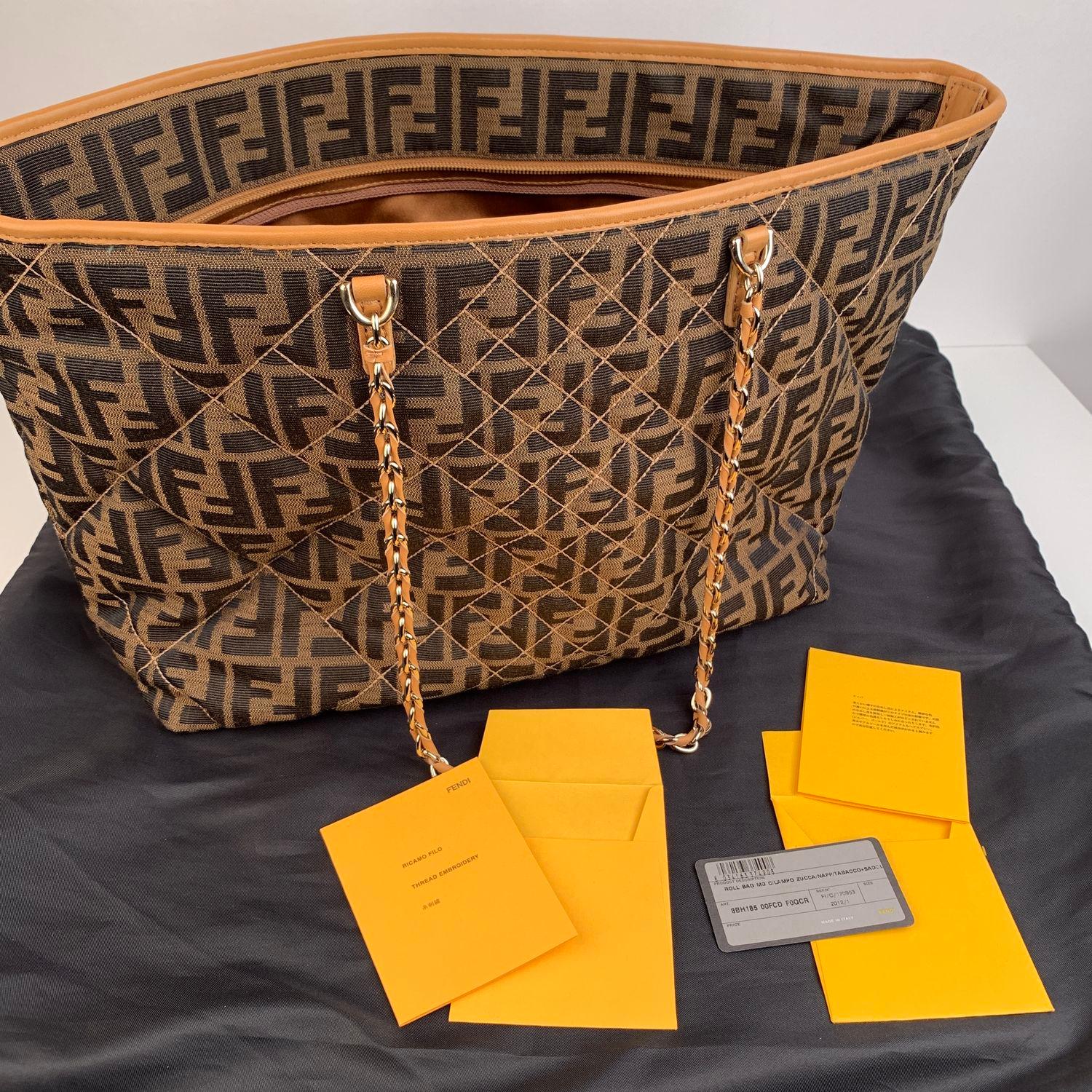 We offer Certificate of Authenticity provided by Entrupy for this item at no further cost.

Beautiful Fendi 'Zucca Quilted Roll' tote. Crafted of Zucca FF monogram Zucca quilted canvas with gold metal hardware. The bag features dual interwoven