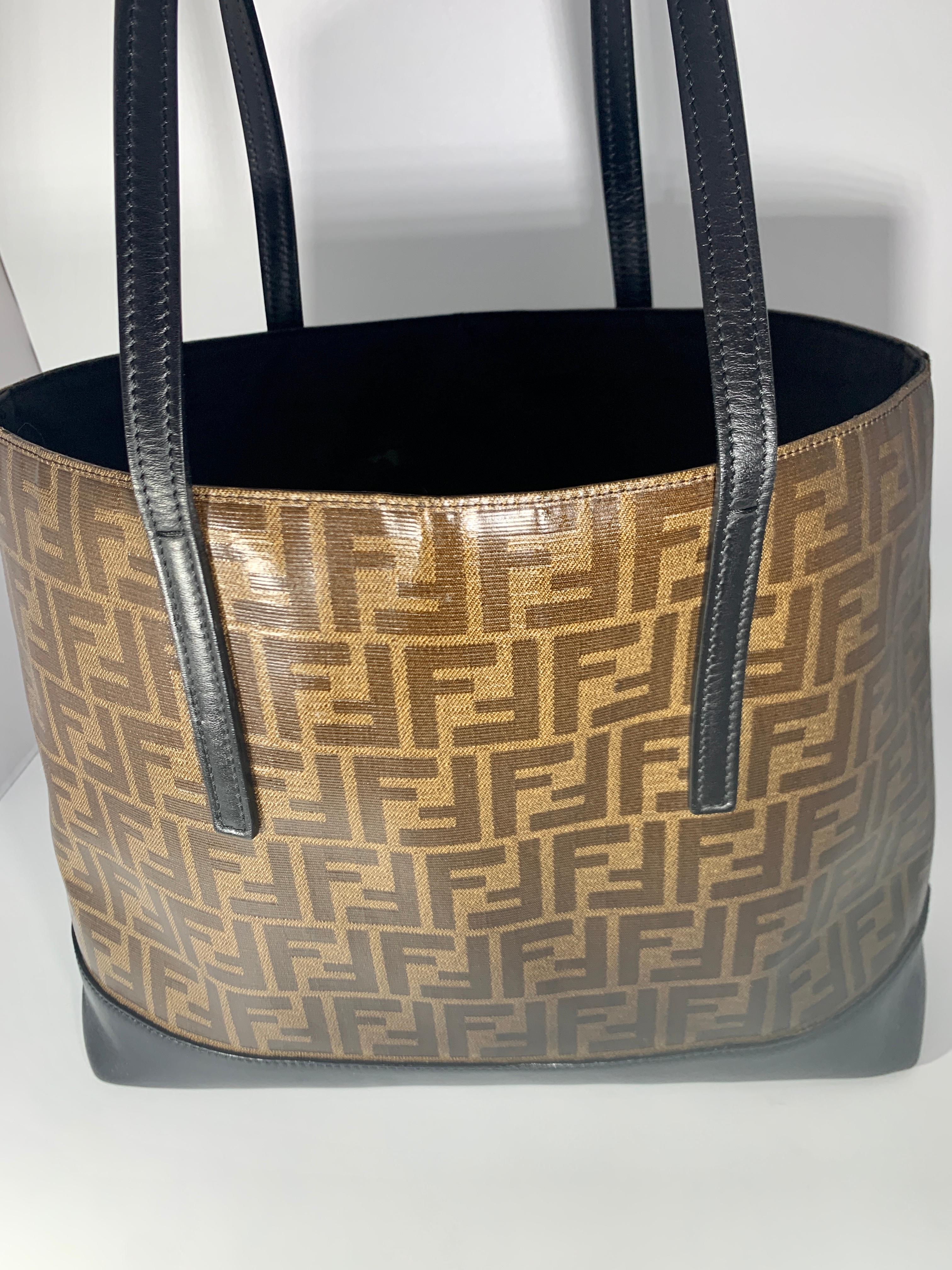 Fendi FF  Logo Print  Neverful Tote Bag - Women - Leather/ Coated  Canvas, Brown/Black
Brown FF print tote bag from Fendi Pre-Owned featuring FF logo print, two top handles, 
 one zippered  pocket inside 
Bottom  and handles are black leather.
Very
