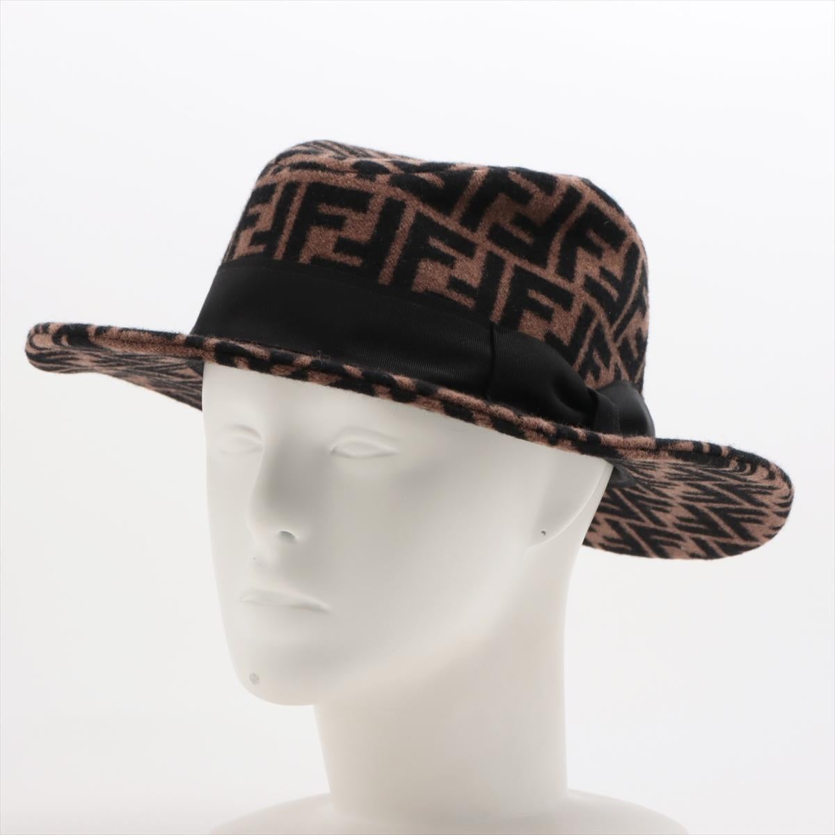 The Fendi Zucca Ribbon Fedora Hat in brown is a luxurious accessory that merges timeless elegance with modern sophistication. Expertly crafted from a blend of wool and cashmere, the fedora offers exceptional warmth and softness, perfect for cooler