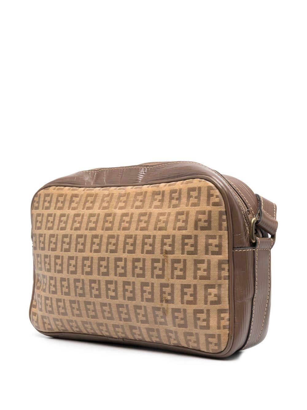 1970s Fendi taupe monogram logo Zucca pattern shoulder bag featuring a taupe leather finishing, a top zip opening, a canvas logo pattern, an inside leather lining, a leather shoulder handle, and an inside logo stamp. 
Circa 1970s. 
Length 10.2in