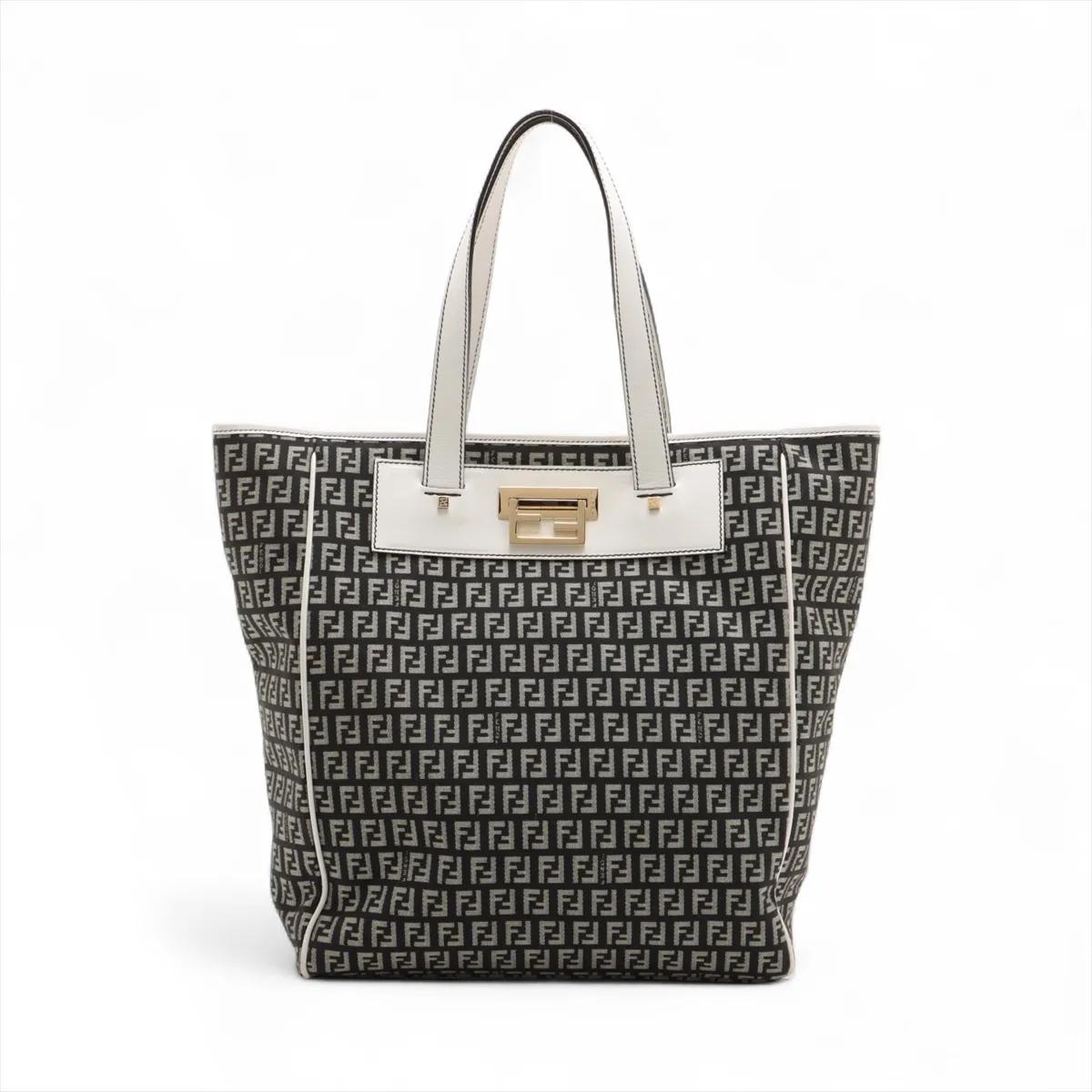 The Fendi Zucchino Canvas Leather Tote Bag in black and white is a chic and versatile accessory that reflects the brand’s iconic style. Crafted from signature Zucchino canvas with leather accents, it showcases a sophisticated black-and-white palette