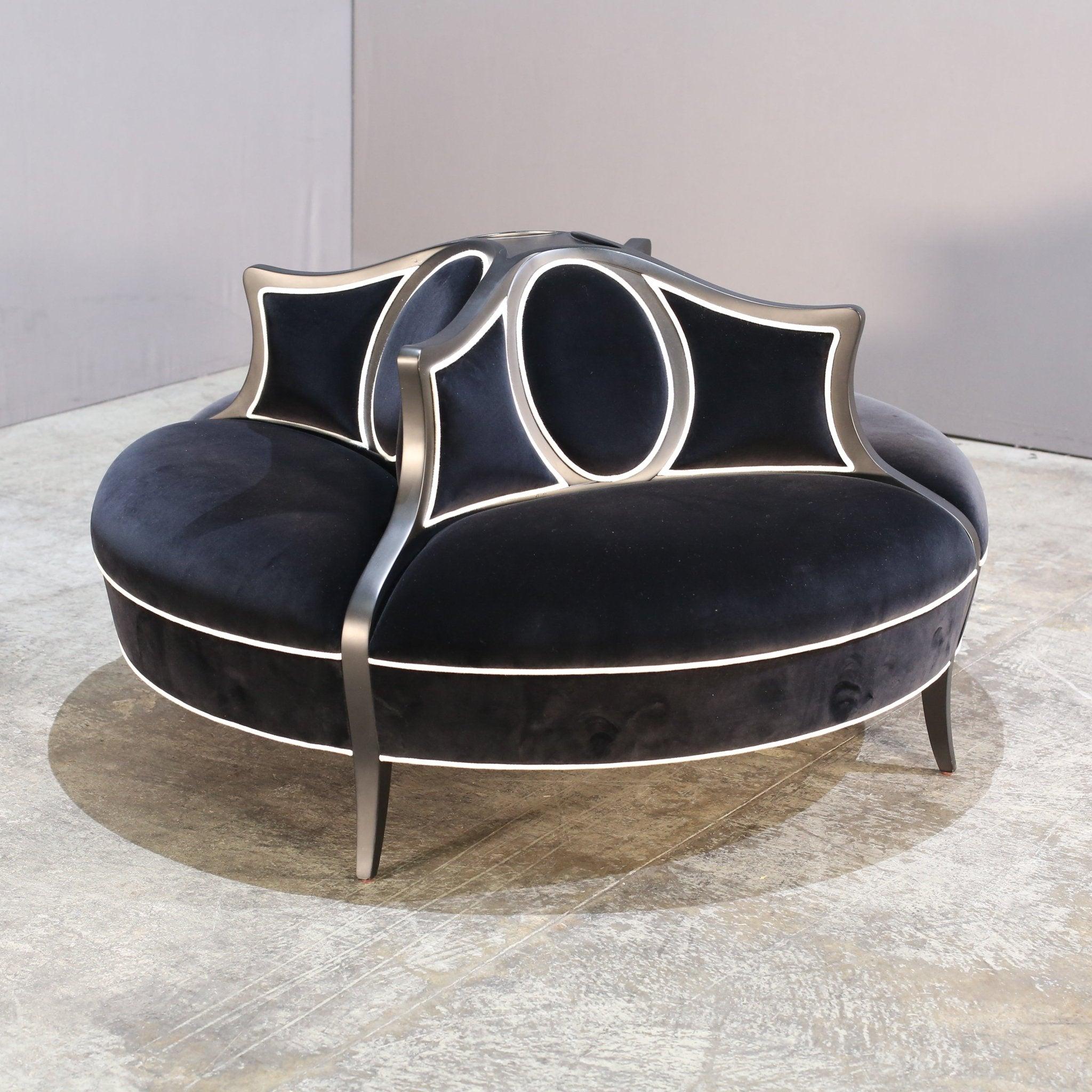 Introducing the epitome of luxury and sophistication - the Féraud Round Chaise by Christopher Guy. This exquisite piece features a sleek and curvaceous design, expertly crafted from the finest materials. The plush upholstery adds a touch of