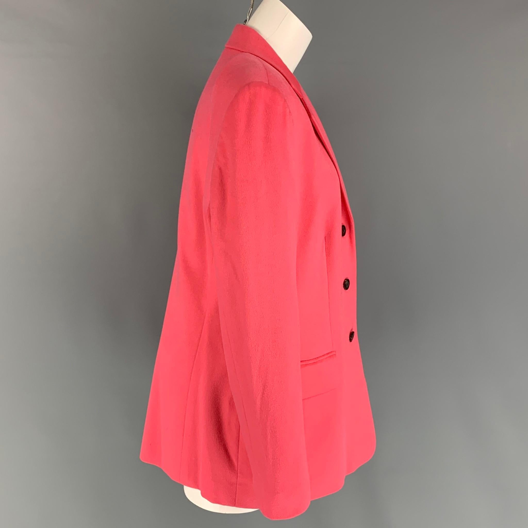 FERAUD blazer comes in a pink cashmere with a full liner featuring a notch lapel, flap pockets, and a three button closure. 

Very Good Pre-Owned Condition.
Marked: D 44 / I 50 / F 46

Measurements:

Shoulder: 18 in.
Bust: 38 in.
Sleeve: 25