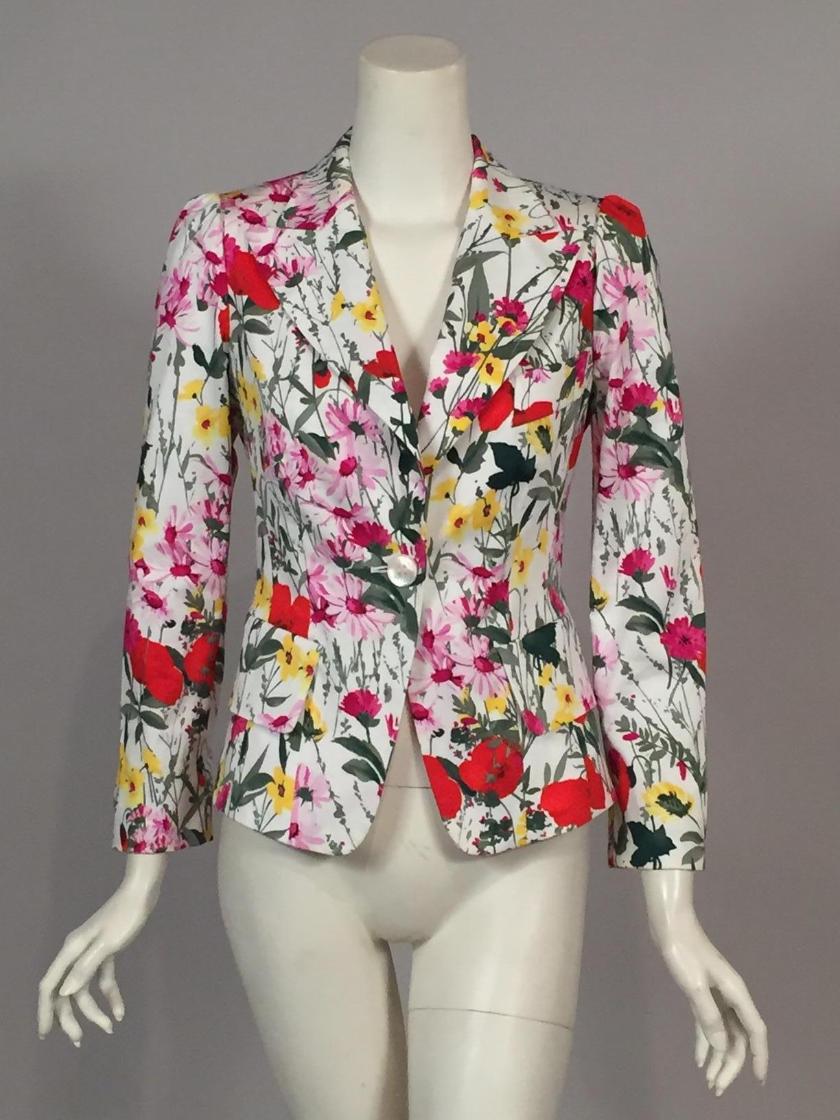 This is the most cheerful summer jacket you could ever wish for. Bright pink, yellow,and orange flowers and several shades of green leaves on white cotton will put a pop of color in to your wardrobe. The jacket has notched lapels, a single button