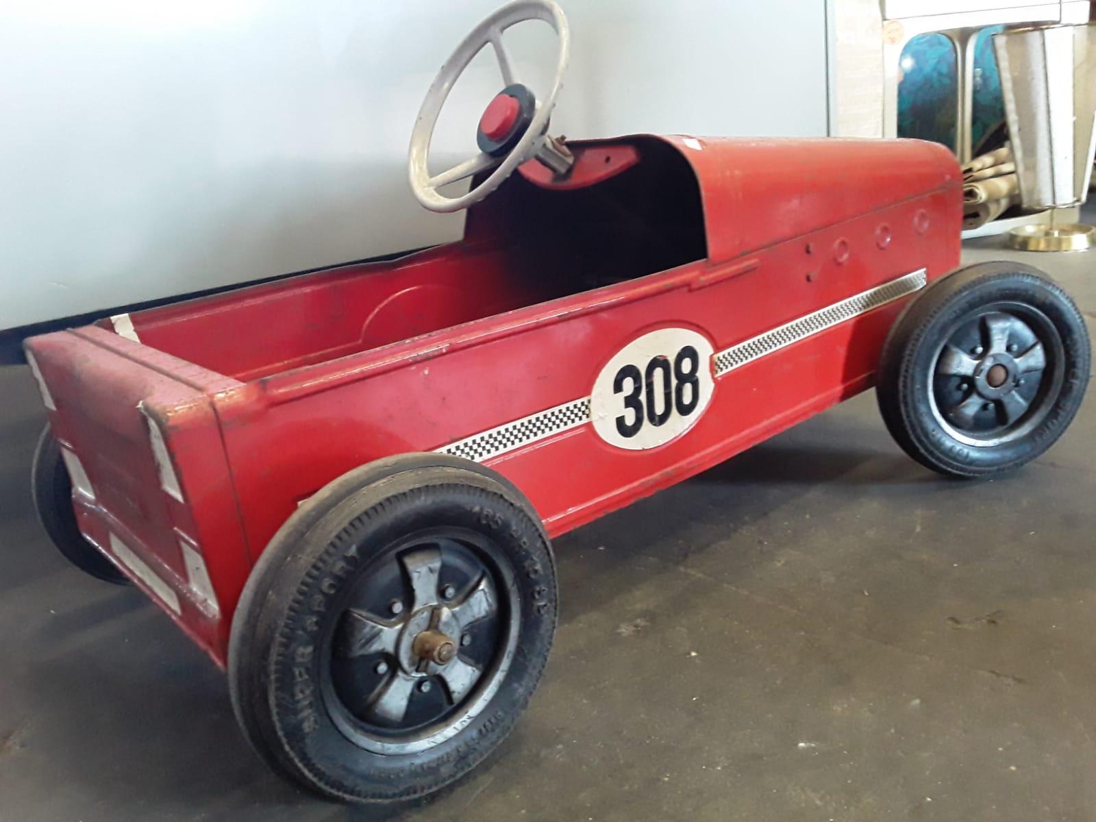 Beautiful children's toy from the 1950s. With old and original paint. The piece is fully functional and still usable as a pedal car.