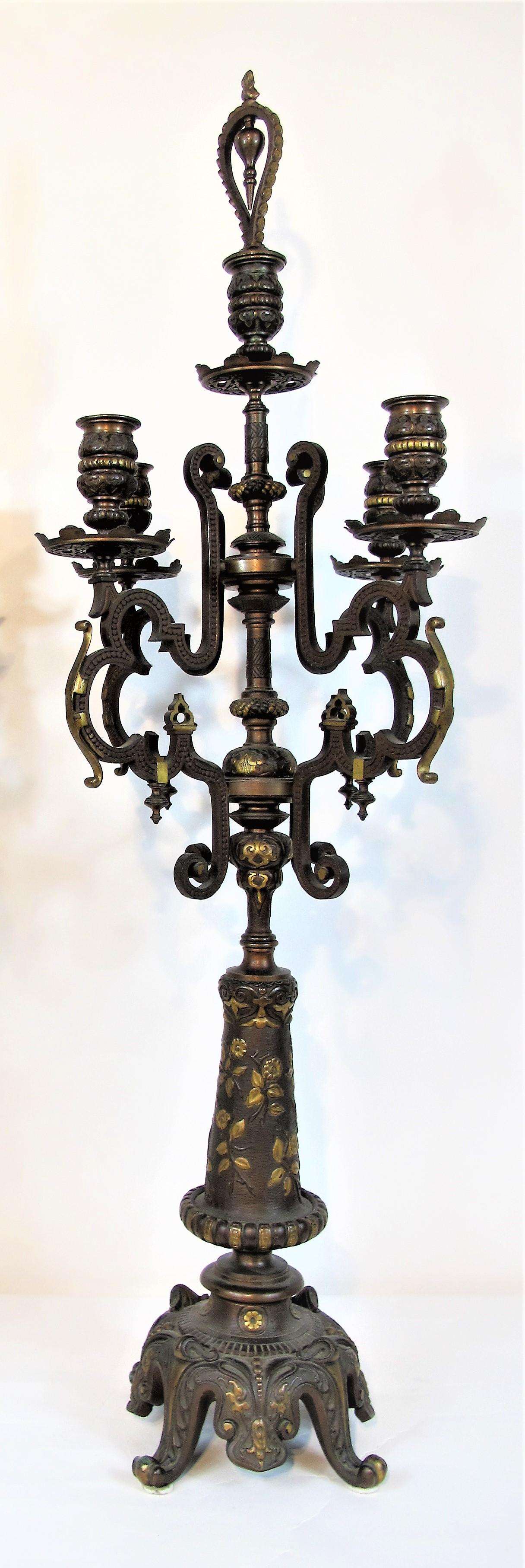 Pair of bronze candelabra in oriental taste with five lights, double patina brown and gold. The cylindrical shaft is carved with flowers and sconces are adorned with friezes of arabesques and pearls. F. Barbedienne signature on the base.

About