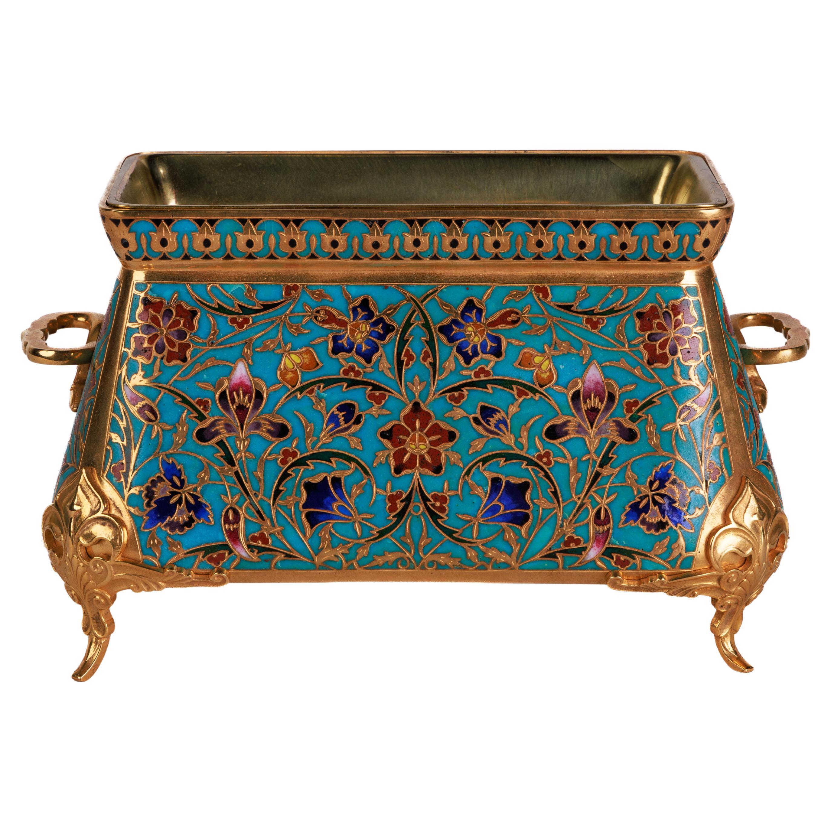 Ferdinand Barbedienne, A French Ormolu and Champleve Enamel Jardiniere, C. 1870, The Design Attributed to Louis Constant Sevin.

An exceptional quality turquoise-ground champlevé enamel and gilt-bronze ormolu jardinière decorated all over with