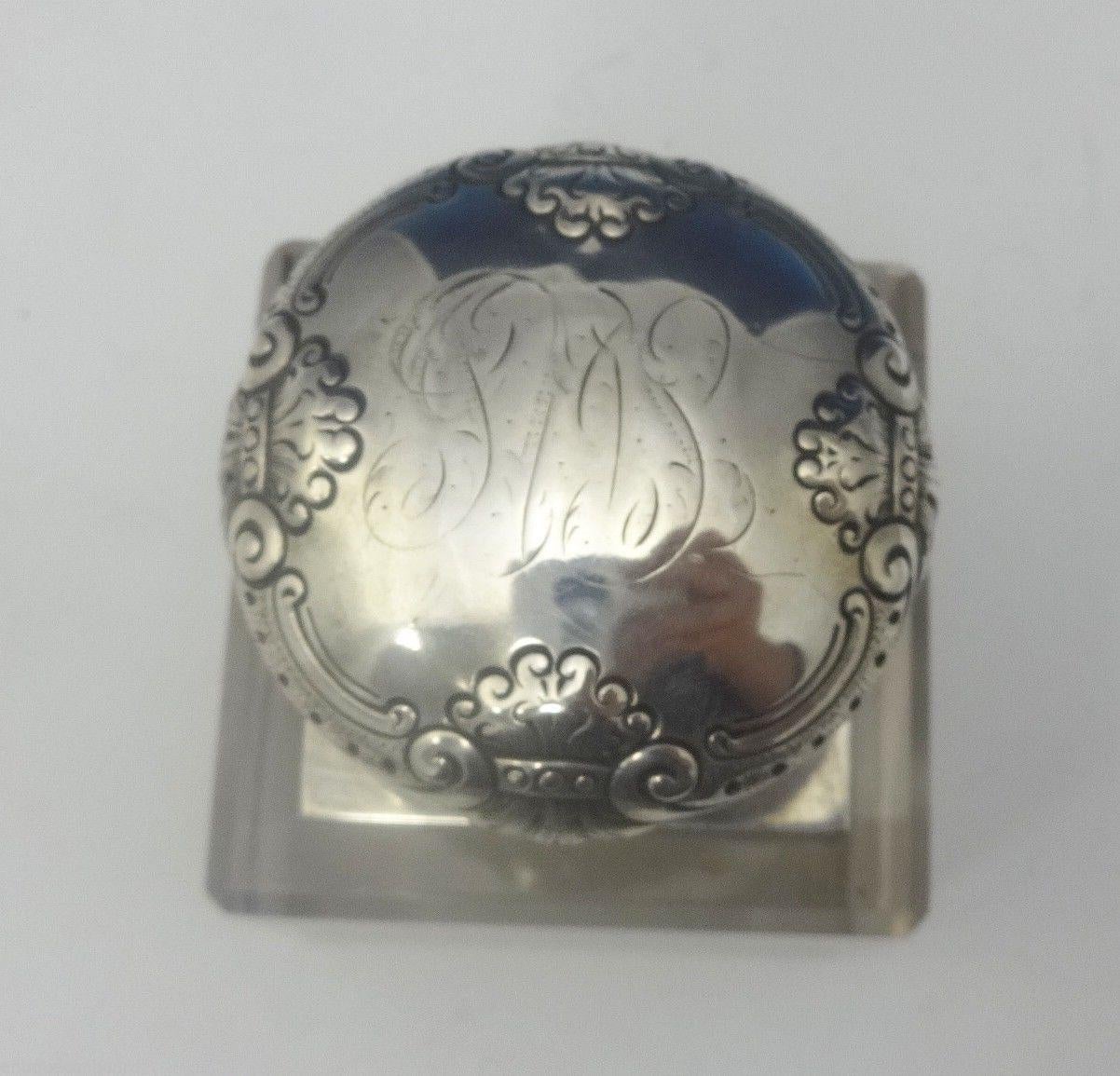 Ferdinand Fuchs & Bros.
This fabulous inkwell was made by Ferd Fuchs & Bros. of New York, circa 1884-1891. The piece is made of crystal with a sterling silver top and it's marked with #446. It has a vintage light monogram (see photo). The