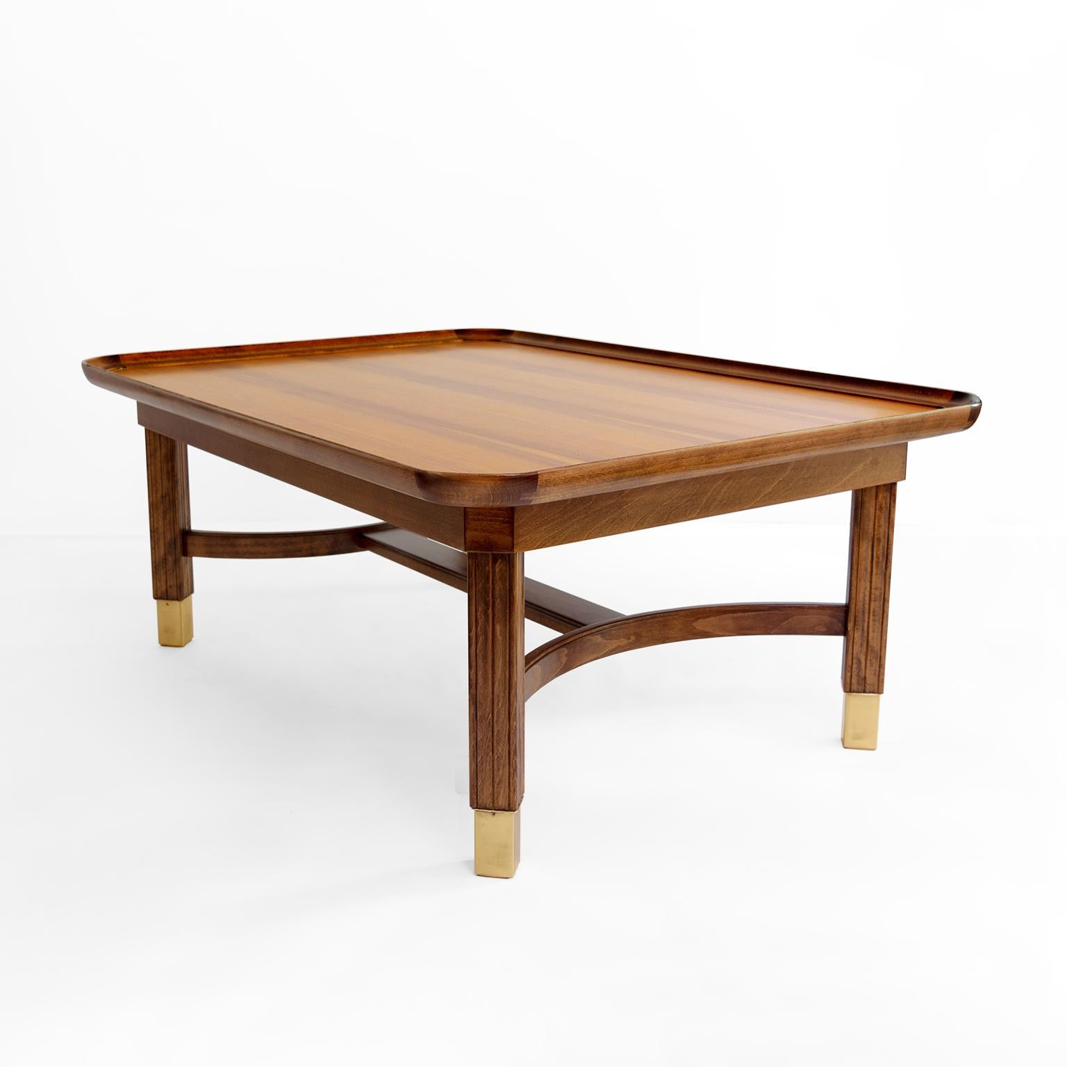 Ferdinand Lundqvist coffee table made in Göteborg, Sweden, circa 1956. Designed exclusively for the luxury liner “Gripsholm” of the Swedish American Line. The rectangular top is in walnut, the frame and carved legs and upper frame in stained beech
