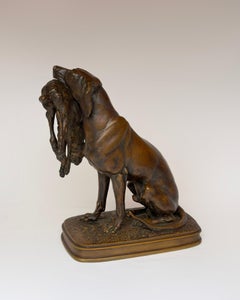 Chien assis tenant un lièvre - Bronze de Ferdinand Pautrot, 19e siècle, signé