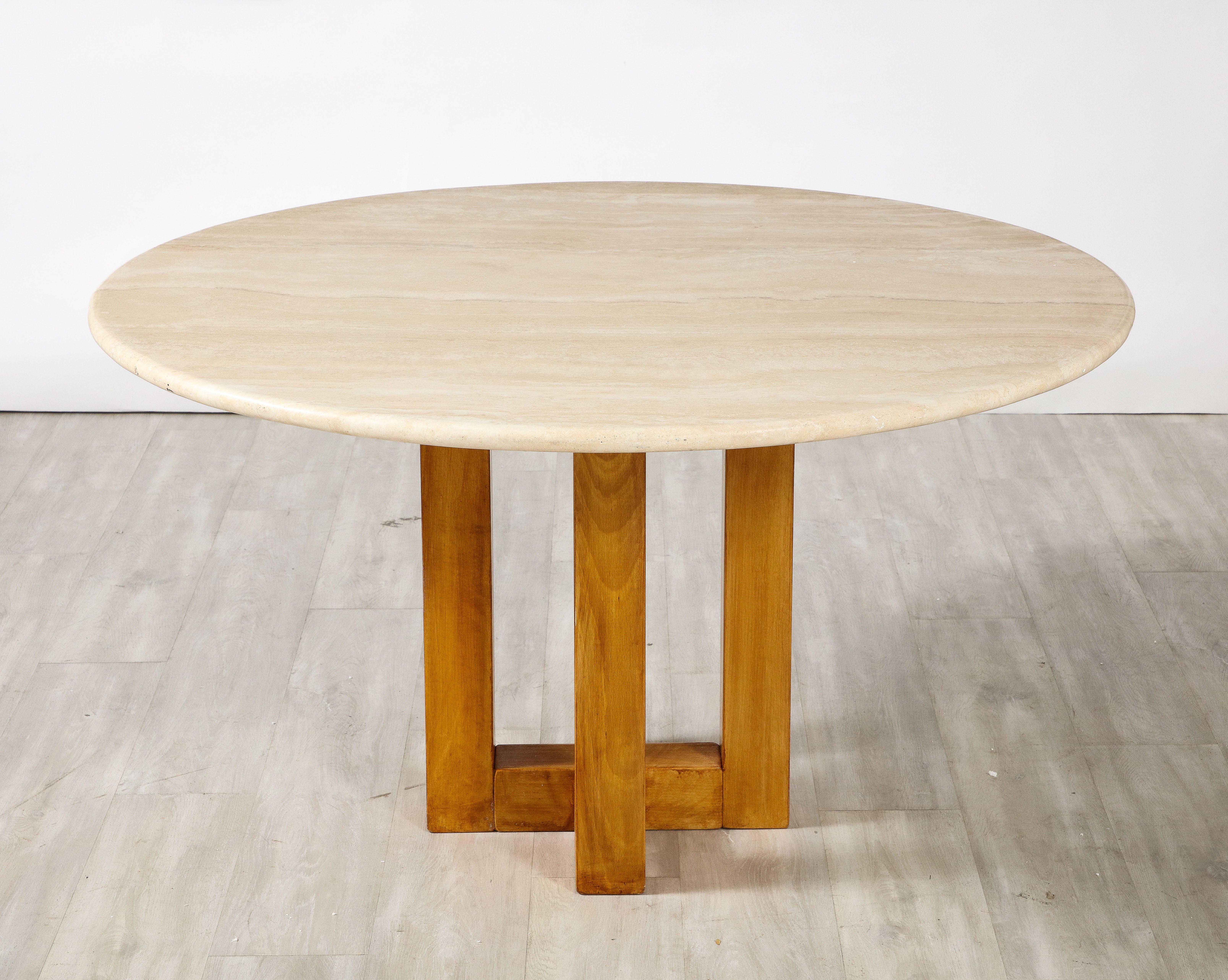 Ferdinando Meccani Travertine, Wood Dining Table or Center Table, Italy, 1970's 
A hand-crafted highly unique dining table or center table with great geometric form, the four square legs contrast beautifully with the circular top.  The legs are