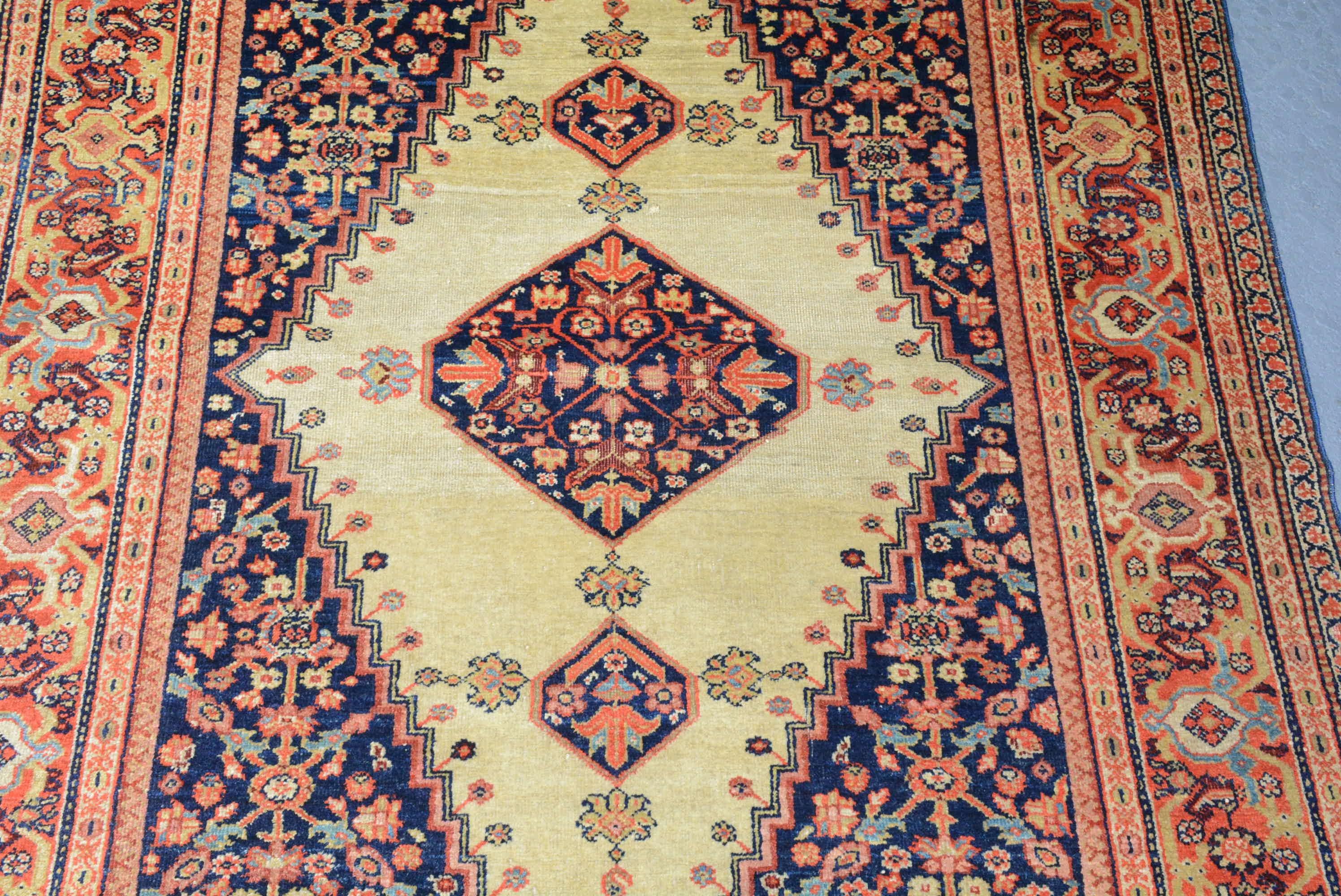 Rugs and carpets from the Fereghan district in northern Persia carefully blend geometric influences from neighboring western tribes with a more refined curvilinear aesthetic as seen in this example.
