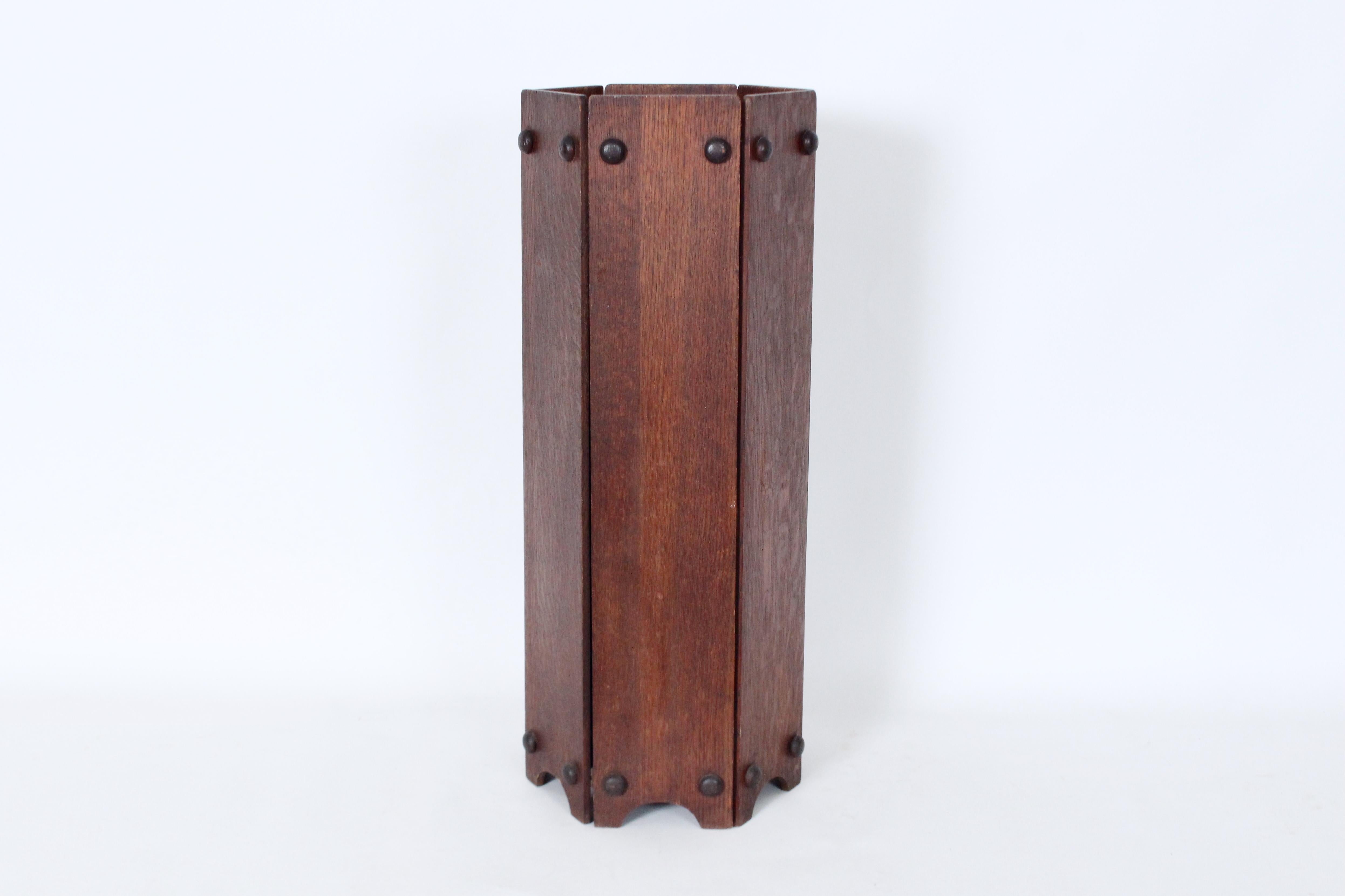 Ferguson Brothers Six Sided Oak Umbrella Stand. Cane Stand. Circa 1910. Featuring six (5.25W) Oak Panels, Button accents, Brass clasps, with removable, inset, hammered Brass tray (8D). Original condition. Sturdy. Balanced. Made in New York. Missing