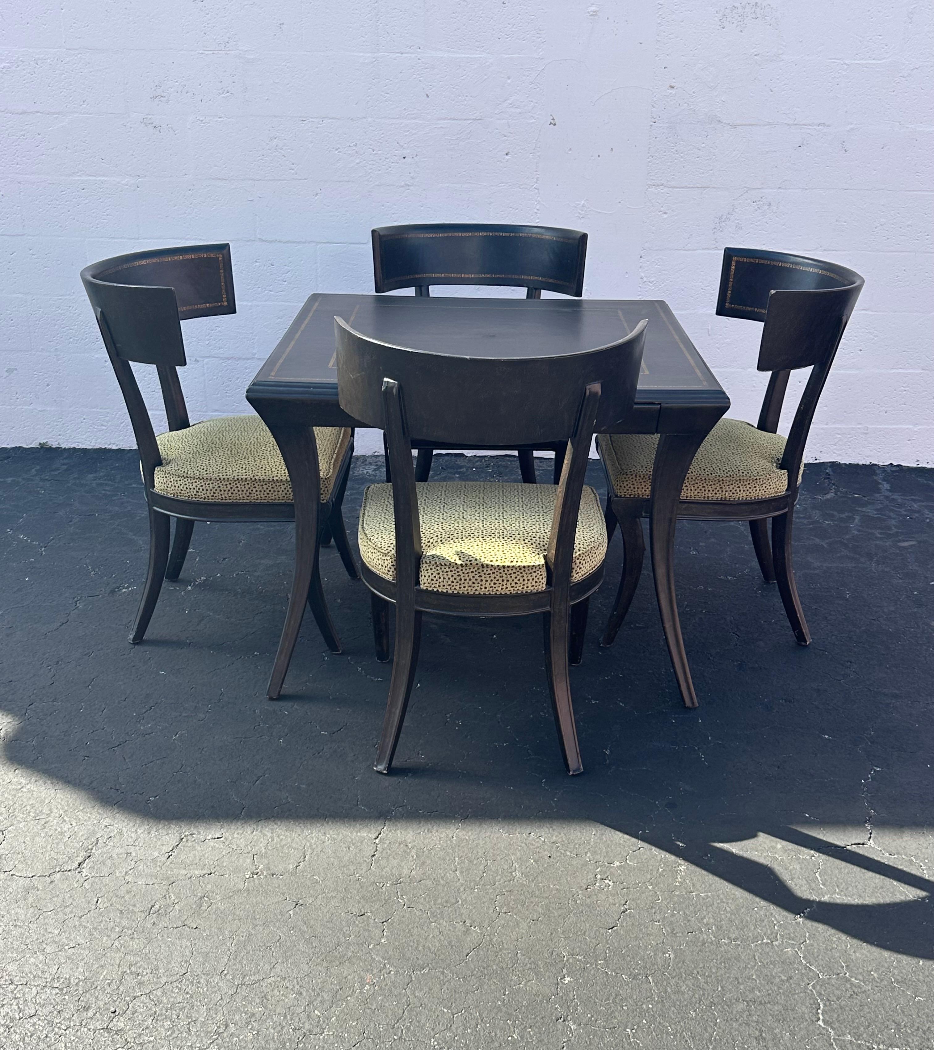 Indulge in the timeless elegance of this exquisite gaming table and 4 leopard print barrel chairs,  dating back to the early 2000s. Crafted with meticulous attention to detail, the set showcases a stunning hand crafted leather wrapped over wood